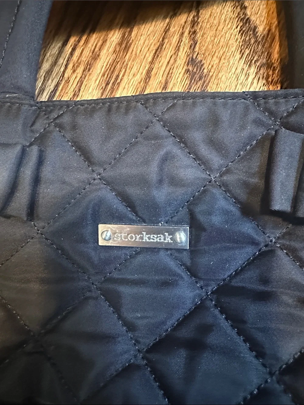 Storksak Black Quilted Tote with Logo Plate